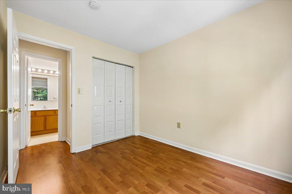 18012 Golden Spring Court, Unit 239 Olney, MD 20832 - Photo 34 of 44 a view of empty room with wooden floor