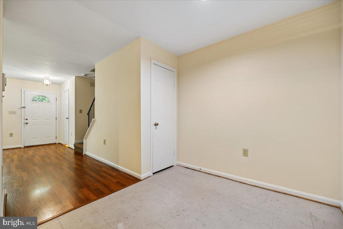 18012 Golden Spring Court, Unit 239 Olney, MD 20832 - Photo 38 of 44 an empty room with wooden floor