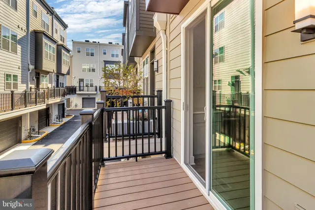 a view of a balcony with wooden floor