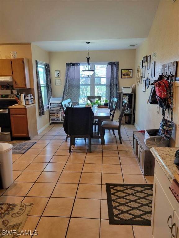 17520 Braddock Road Fort Myers, FL 33967 - Photo 12 of 31 a living room with furniture a dining table and a fireplace