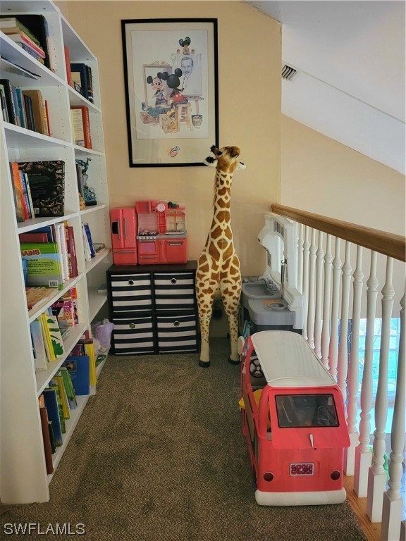 17520 Braddock Road Fort Myers, FL 33967 - Photo 25 of 31 a room with toys and book shelf