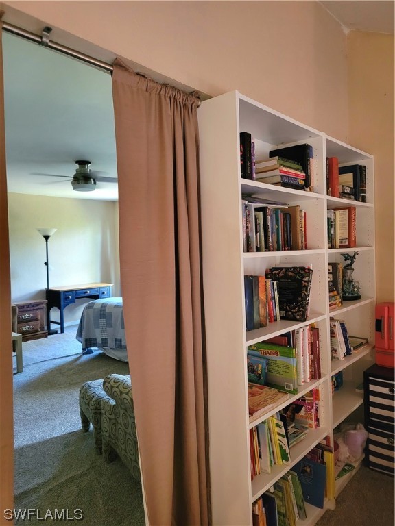 17520 Braddock Road Fort Myers, FL 33967 - Photo 26 of 31 a bedroom with furniture and a book shelf