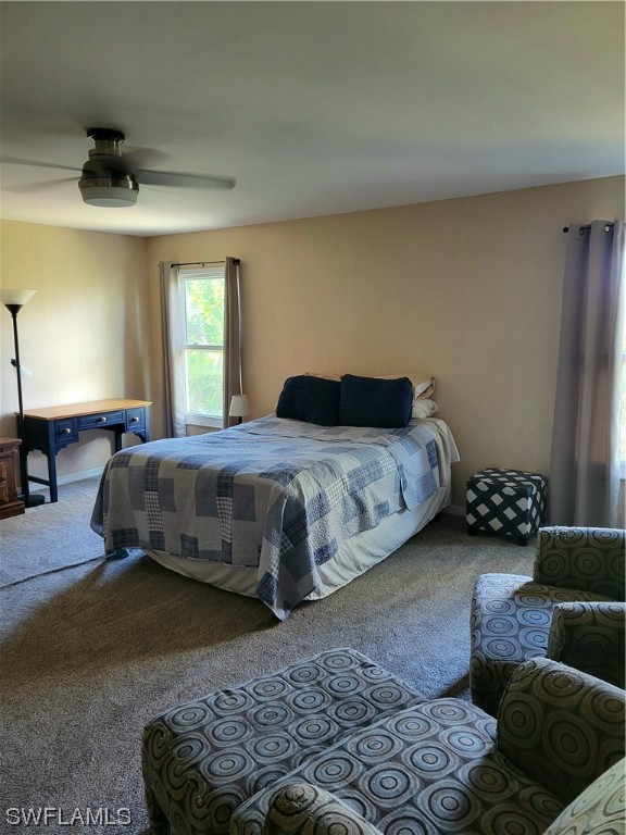 17520 Braddock Road Fort Myers, FL 33967 - Photo 28 of 31 a bedroom with a bed couch and window