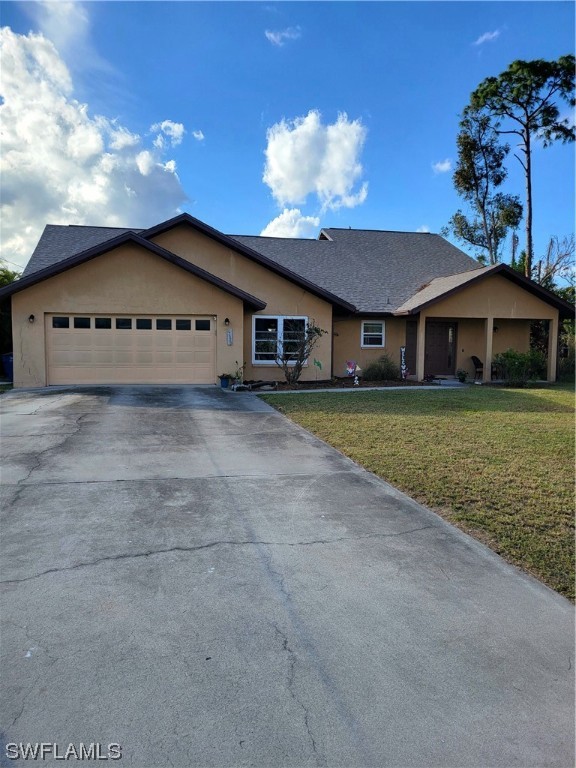17520 Braddock Road Fort Myers, FL 33967 - Photo 3 of 31 a view of a house with a yard and potted plants