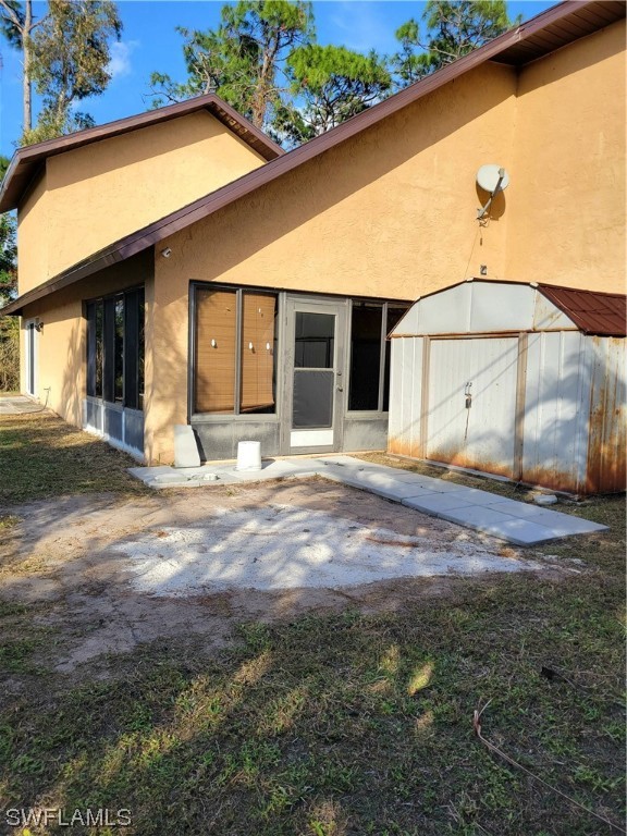 17520 Braddock Road Fort Myers, FL 33967 - Photo 31 of 31 a view of a house with a yard