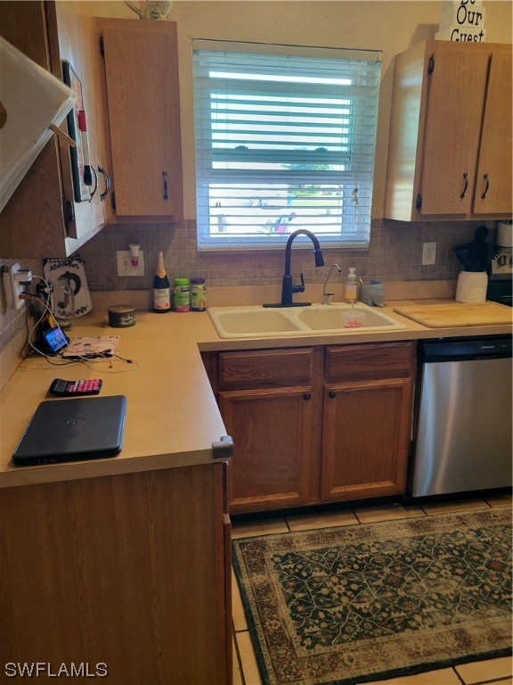 17520 Braddock Road Fort Myers, FL 33967 - Photo 9 of 31 a kitchen with wooden cabinets a sink and a stove