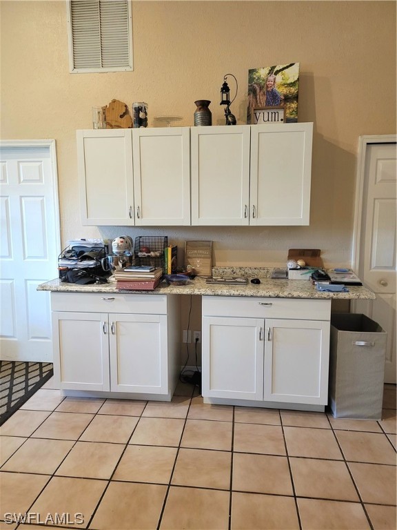 17520 Braddock Road Fort Myers, FL 33967 - Photo 10 of 31 a kitchen with a sink a stove and cabinets