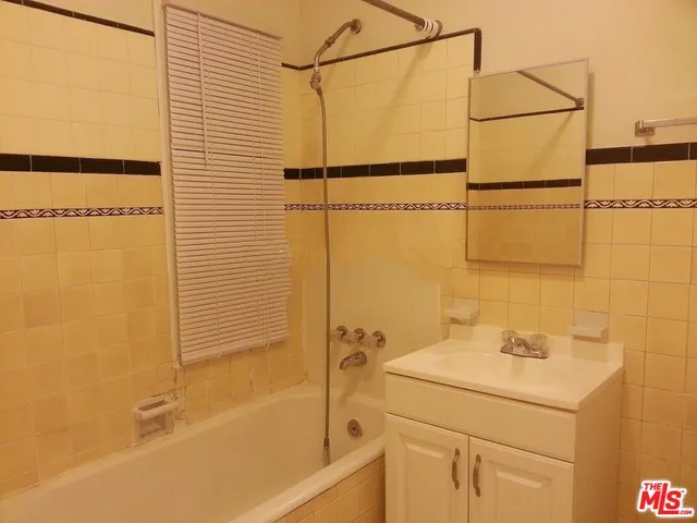 a bathroom with a sink and a shower