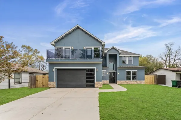 front view of a house with a yard