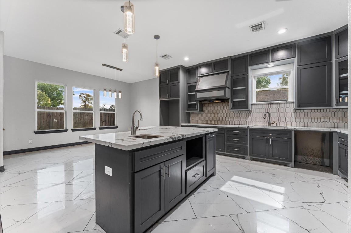 5215 Kelso Street Houston, TX 77021 - Photo 13 of 47 a kitchen with a stove sink and cabinets