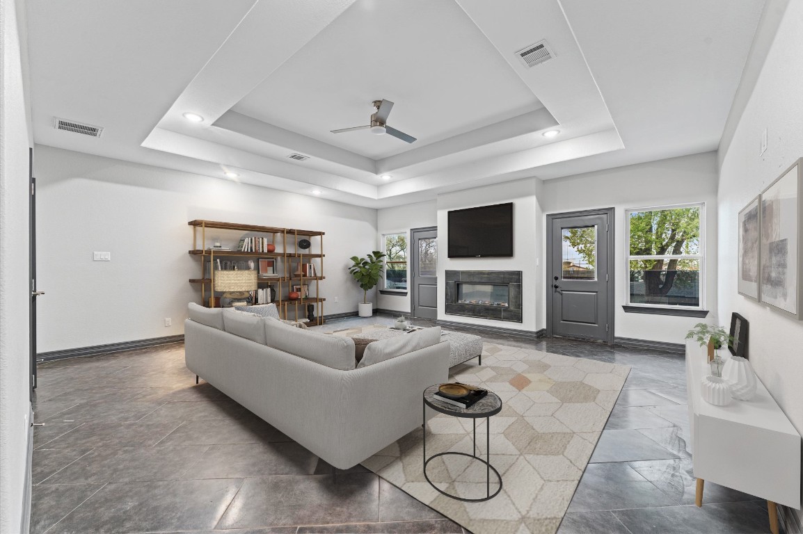 5215 Kelso Street Houston, TX 77021 - Photo 25 of 47 a living room with furniture a fireplace and a flat screen tv