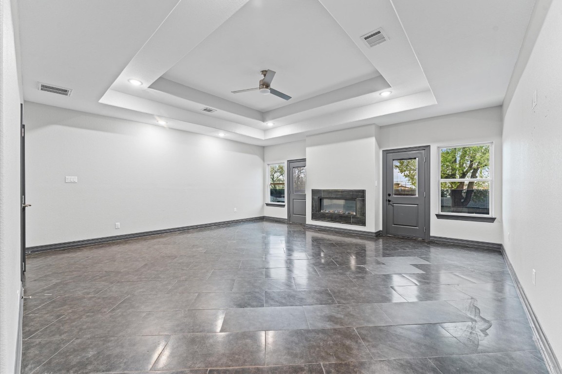 5215 Kelso Street Houston, TX 77021 - Photo 26 of 47 an empty room with fireplace and windows