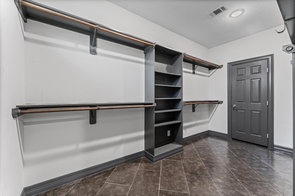 5215 Kelso Street Houston, TX 77021 - Photo 28 of 47 a view of walk in closet with empty racks