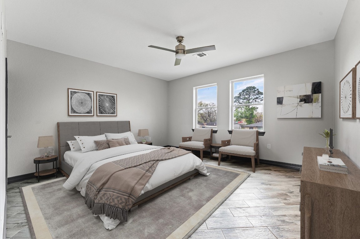 5215 Kelso Street Houston, TX 77021 - Photo 34 of 47 a bedroom with a bed and wooden floor