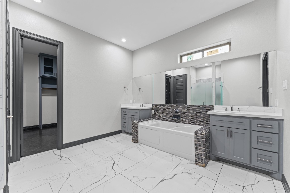 5215 Kelso Street Houston, TX 77021 - Photo 38 of 47 a bathroom with a granite countertop sink a mirror and a