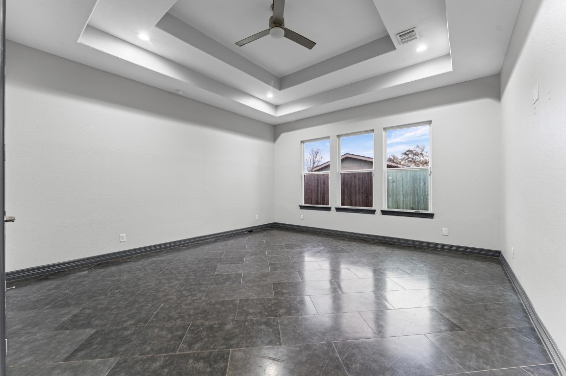 5215 Kelso Street Houston, TX 77021 - Photo 42 of 47 an empty room with wooden floor and windows