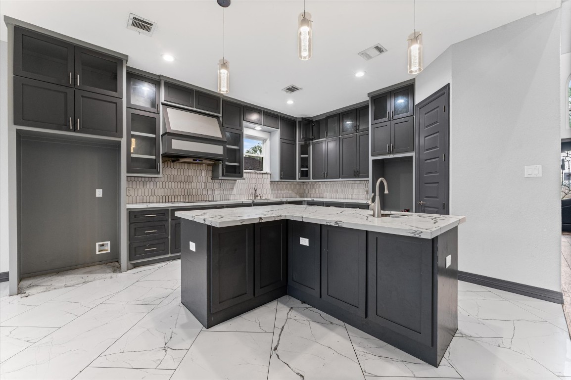 5215 Kelso Street Houston, TX 77021 - Photo 10 of 47 a kitchen with stainless steel appliances granite countertop a sink and cabinets
