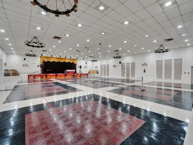 a view of a living room and kitchen