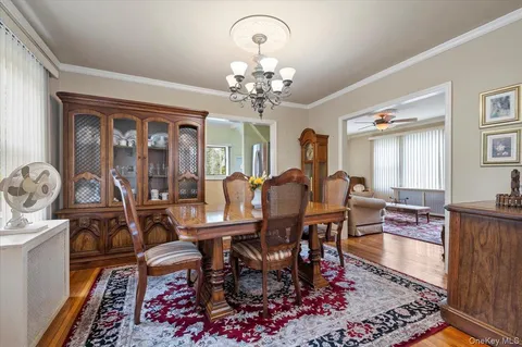 a view of a livingroom with furniture and a flat screen tv