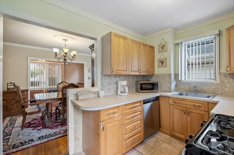 a kitchen that has a refrigerator and a stove