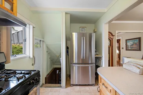 a bedroom with a bed dresser and a window