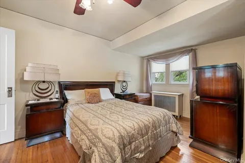 a bedroom with furniture and a window