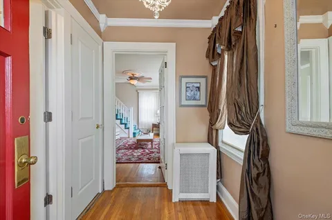 a view of front door with wooden floor