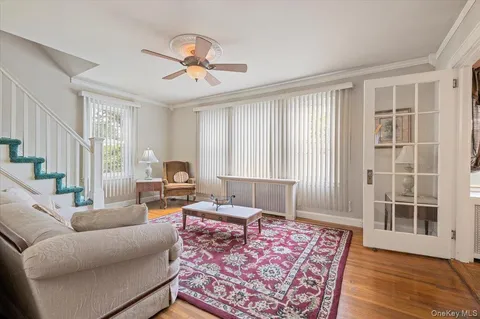 a living room with furniture and a rug