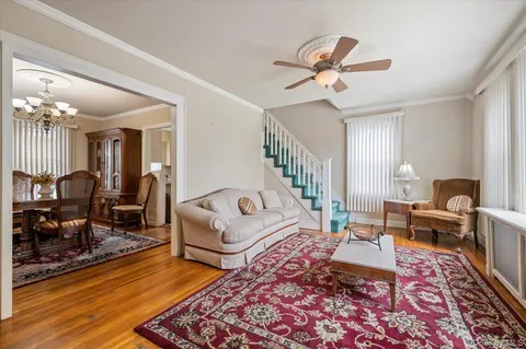 a bedroom with furniture and a rug