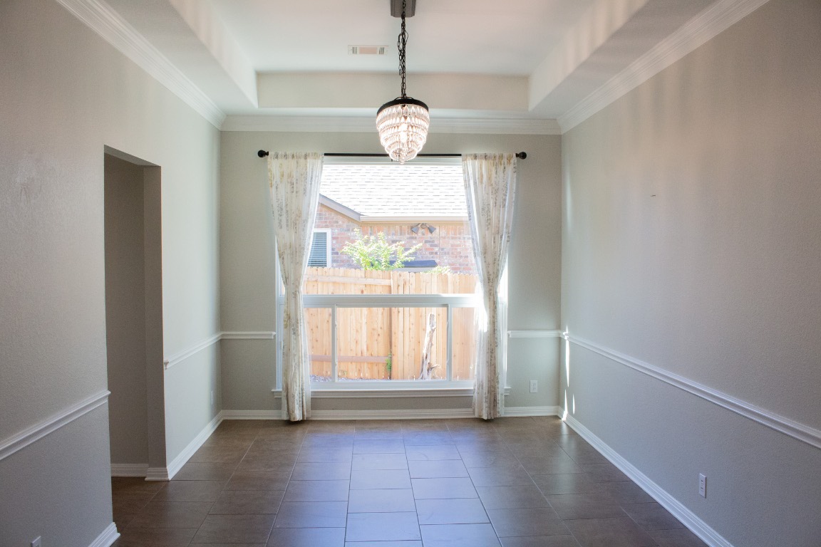 12721 Oxen Way Austin, TX 78732 - Photo 11 of 37 a view of an empty room with a window