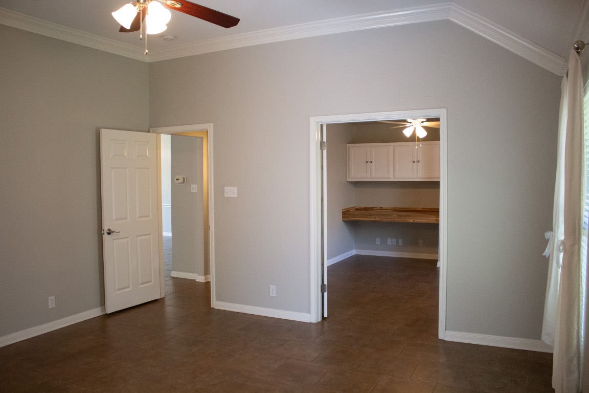12721 Oxen Way Austin, TX 78732 - Photo 15 of 37 a view of an empty room and chandelier fan fire place