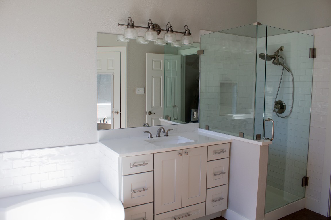 12721 Oxen Way Austin, TX 78732 - Photo 17 of 37 a bathroom with a sink and a mirror