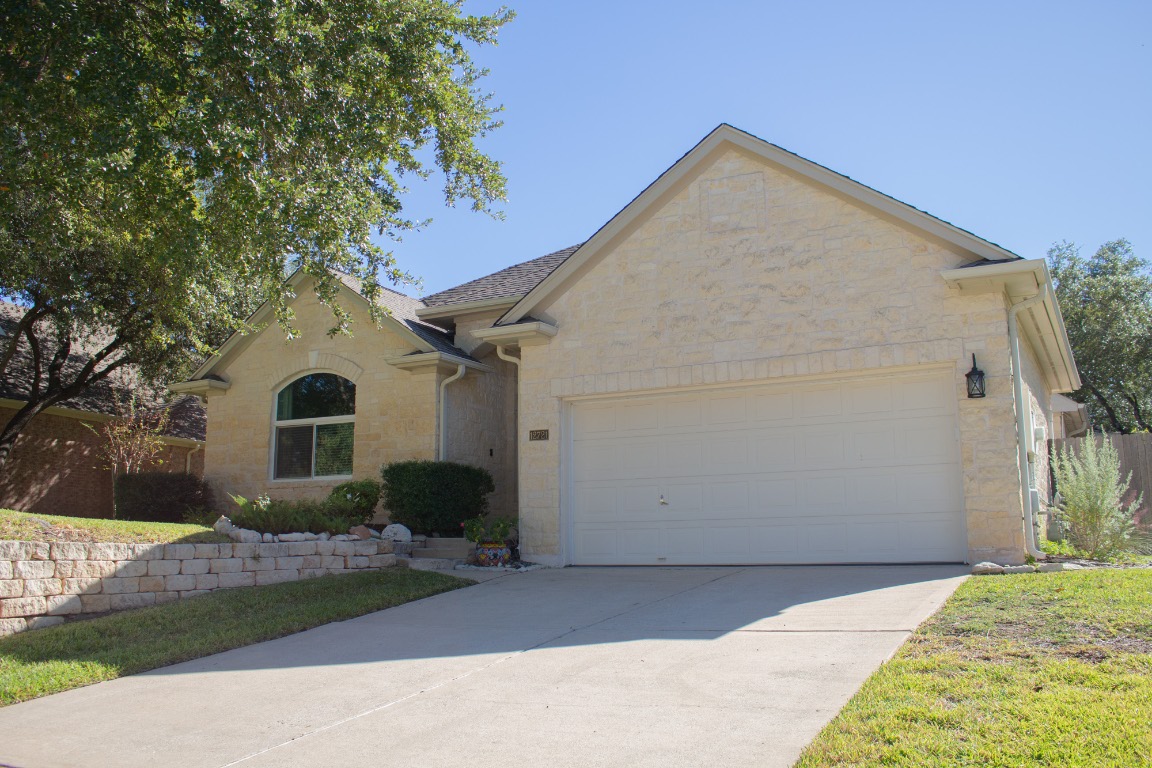12721 Oxen Way Austin, TX 78732 - Photo 2 of 37 a view of a house with a yard
