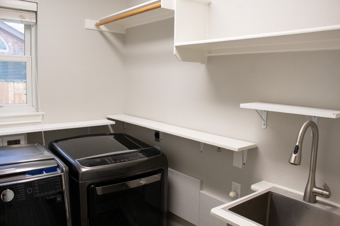 12721 Oxen Way Austin, TX 78732 - Photo 23 of 37 a kitchen with a sink and cabinets