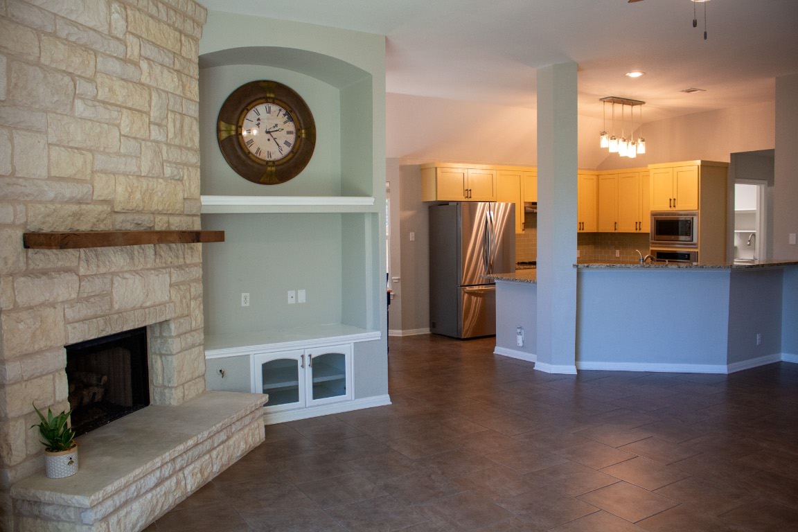 12721 Oxen Way Austin, TX 78732 - Photo 7 of 37 a view of a livingroom with a fireplace