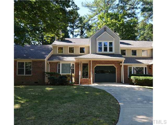 909 Bridge Way Raleigh, NC 27615 - Photo 1 of 22 a front view of a house with a yard and garage