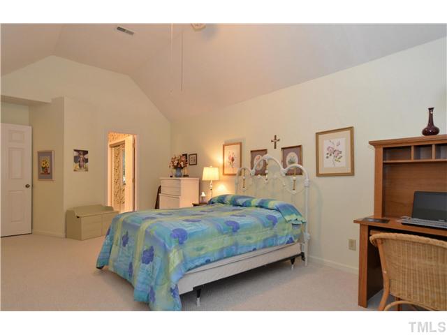 909 Bridge Way Raleigh, NC 27615 - Photo 11 of 22 a bedroom with a bed next to a window