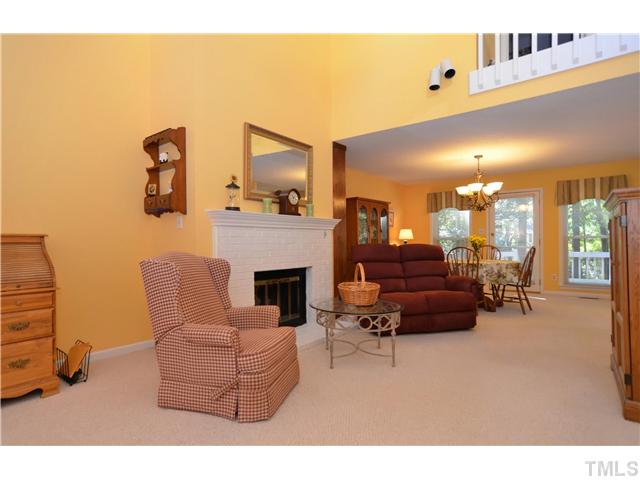 909 Bridge Way Raleigh, NC 27615 - Photo 3 of 22 a living room with furniture and a fireplace