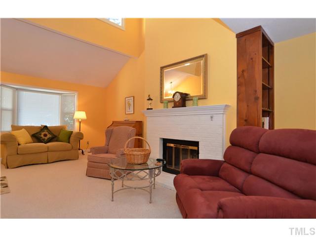 909 Bridge Way Raleigh, NC 27615 - Photo 5 of 22 a living room with furniture and a fireplace