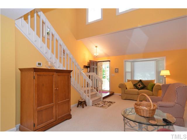 909 Bridge Way Raleigh, NC 27615 - Photo 6 of 22 a living room with furniture a rug and a window