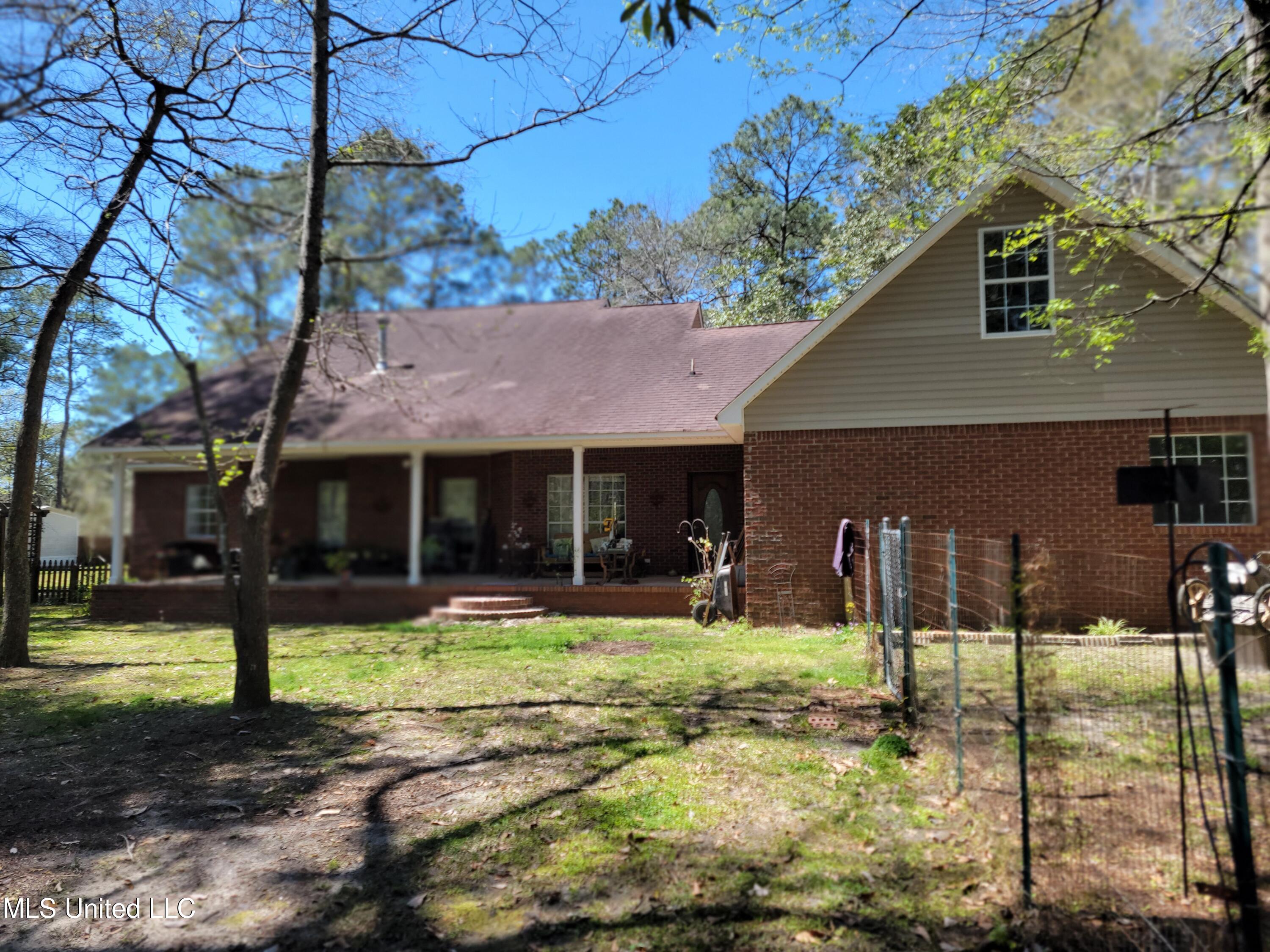5540 Roxane Street Gautier, MS 39553 - Photo 31 of 35 Back of house/fenced in area