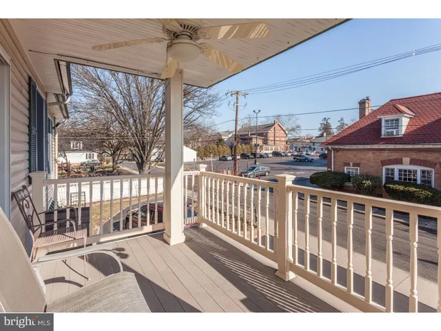 a view of a balcony with wooden floor