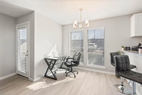 a view of a livingroom with furniture and wooden floor
