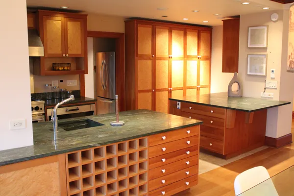 a kitchen with stainless steel appliances granite countertop a sink stove and cabinets