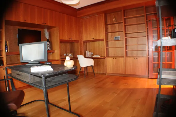 a room with a table and chairs
