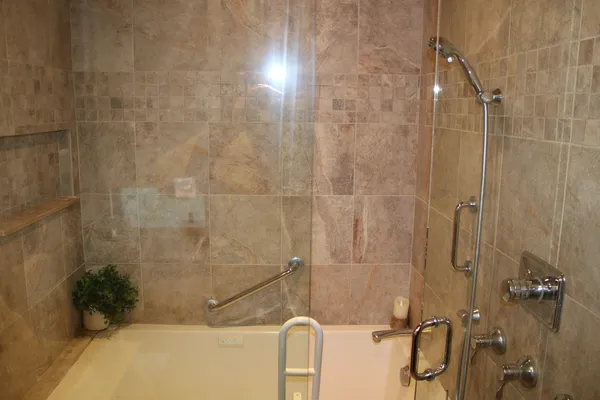 a bathroom with a shower and a tub