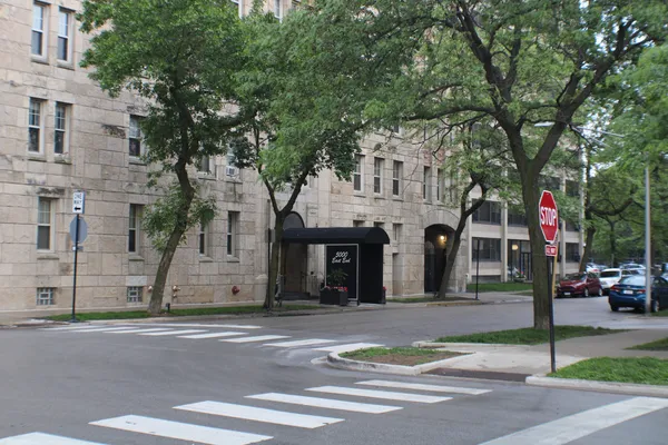 a front view of a building with street view