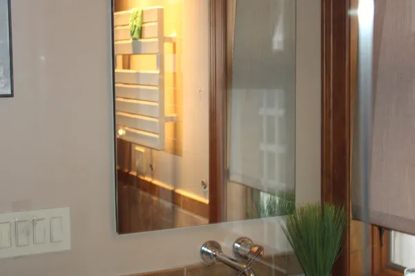 a bedroom with a bed lamps and window