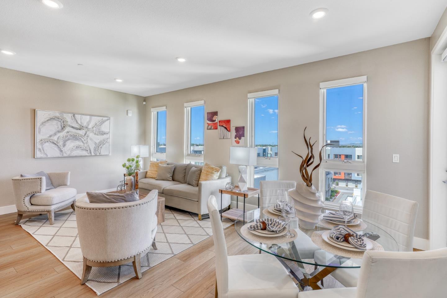 3512 Vision Common, Unit 501 Fremont, CA 94538 - Photo 1 of 1 a living room with furniture and a wooden floor