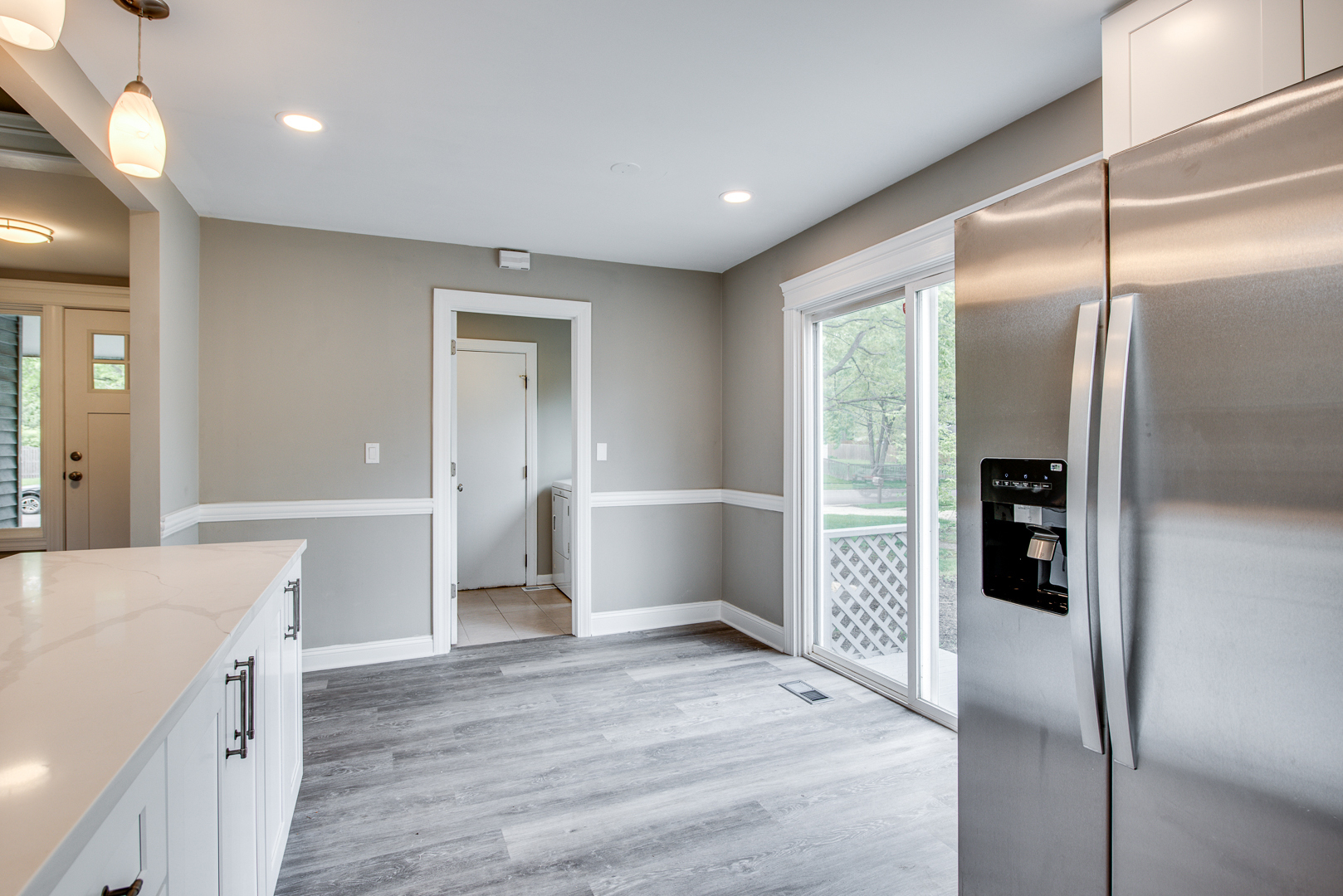 106 Foxcroft Road Naperville, IL 60565 - Photo 6 of 21 a hallway with wooden floor and cabinet